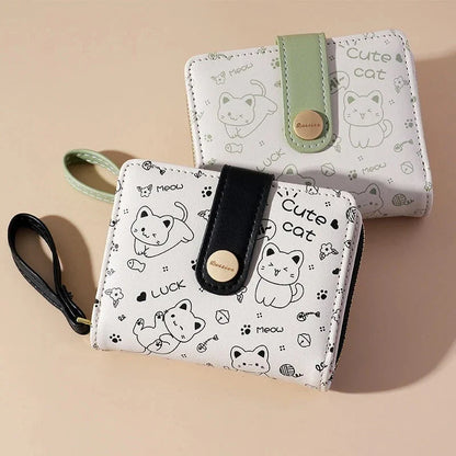 A stylish compact wallet featuring a playful cat-themed design with a tilted head motif, available in a range of candy-inspired colours.