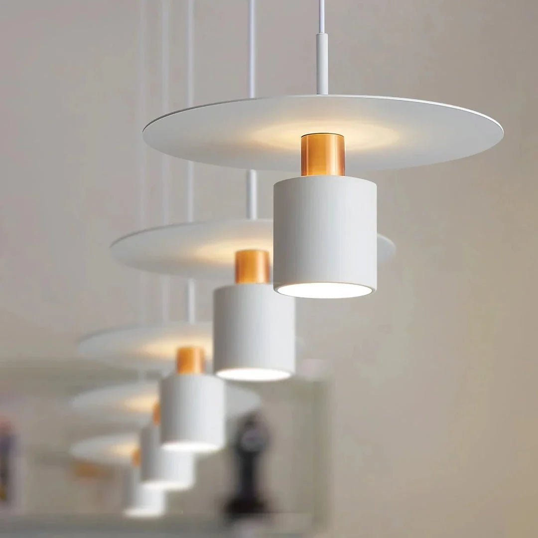 A modern, minimalist pendant light with a sleek, painted metal design, perfect for enhancing the ambiance of cafes, bedrooms, and other contemporary interior spaces.