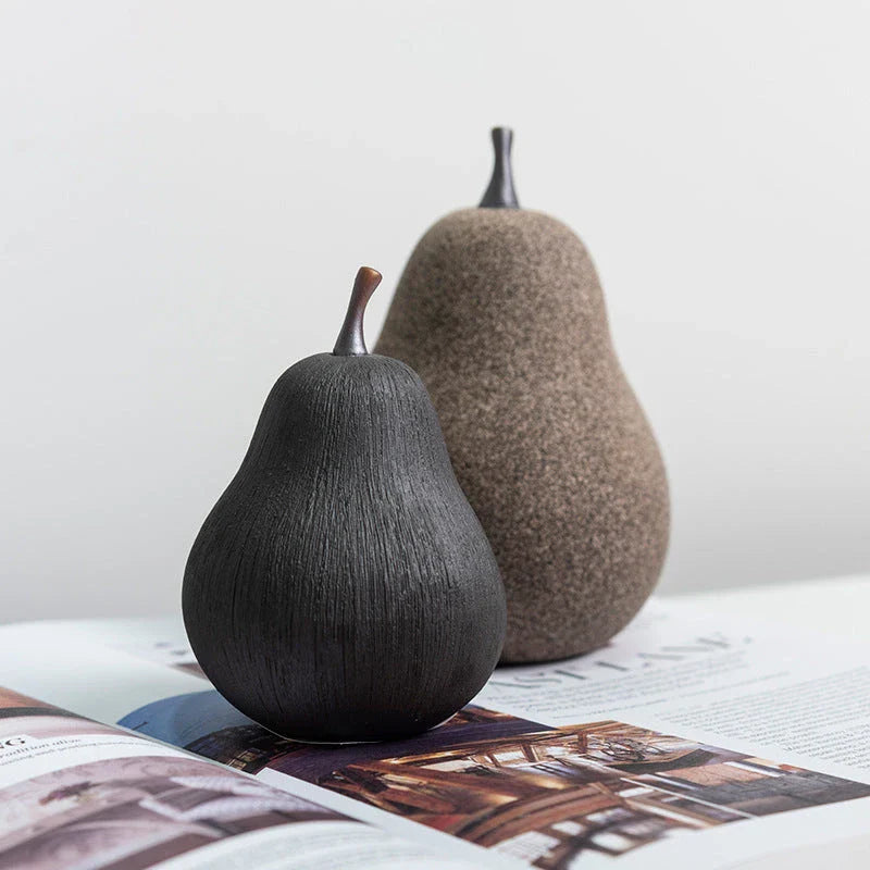 Handcrafted ceramic pear decoration with a sleek, modern design, perfect for adding a touch of natural elegance to any Kiwi home