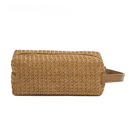 A stylish and practical cosmetic bag made from eco-friendly straw material with a unique knitting pattern, designed for the modern Kiwi woman.