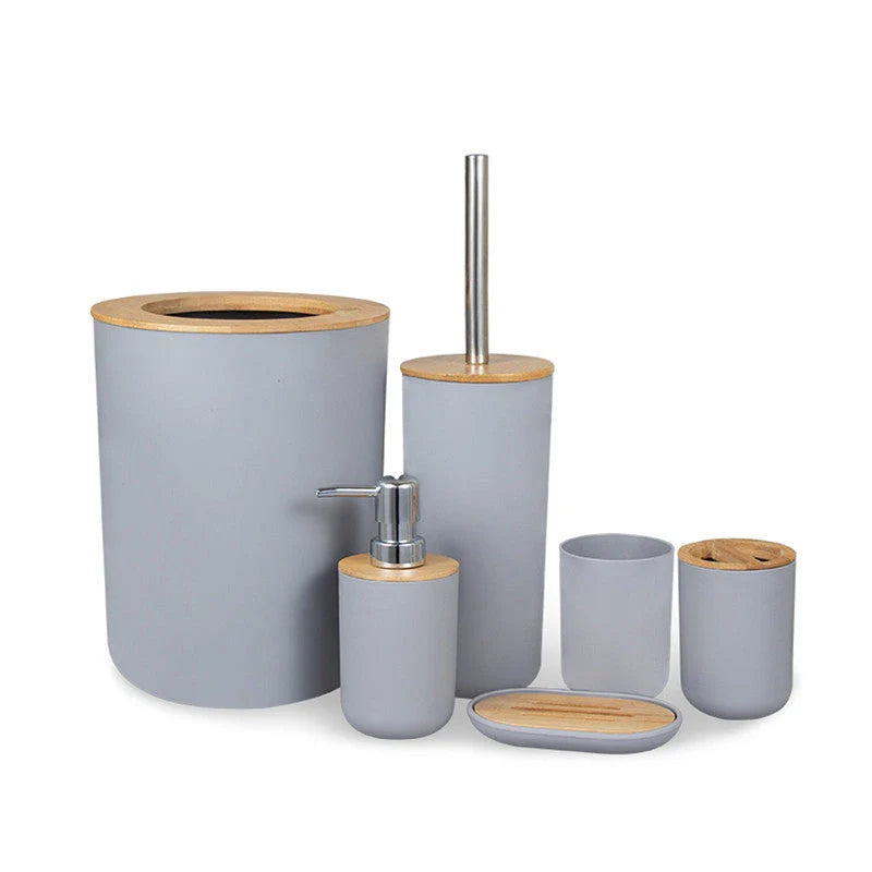 A 6-piece bamboo bathroom accessory set with a trash can, toilet brush, lotion bottle, soap box, toothbrush holder, and mouth cup