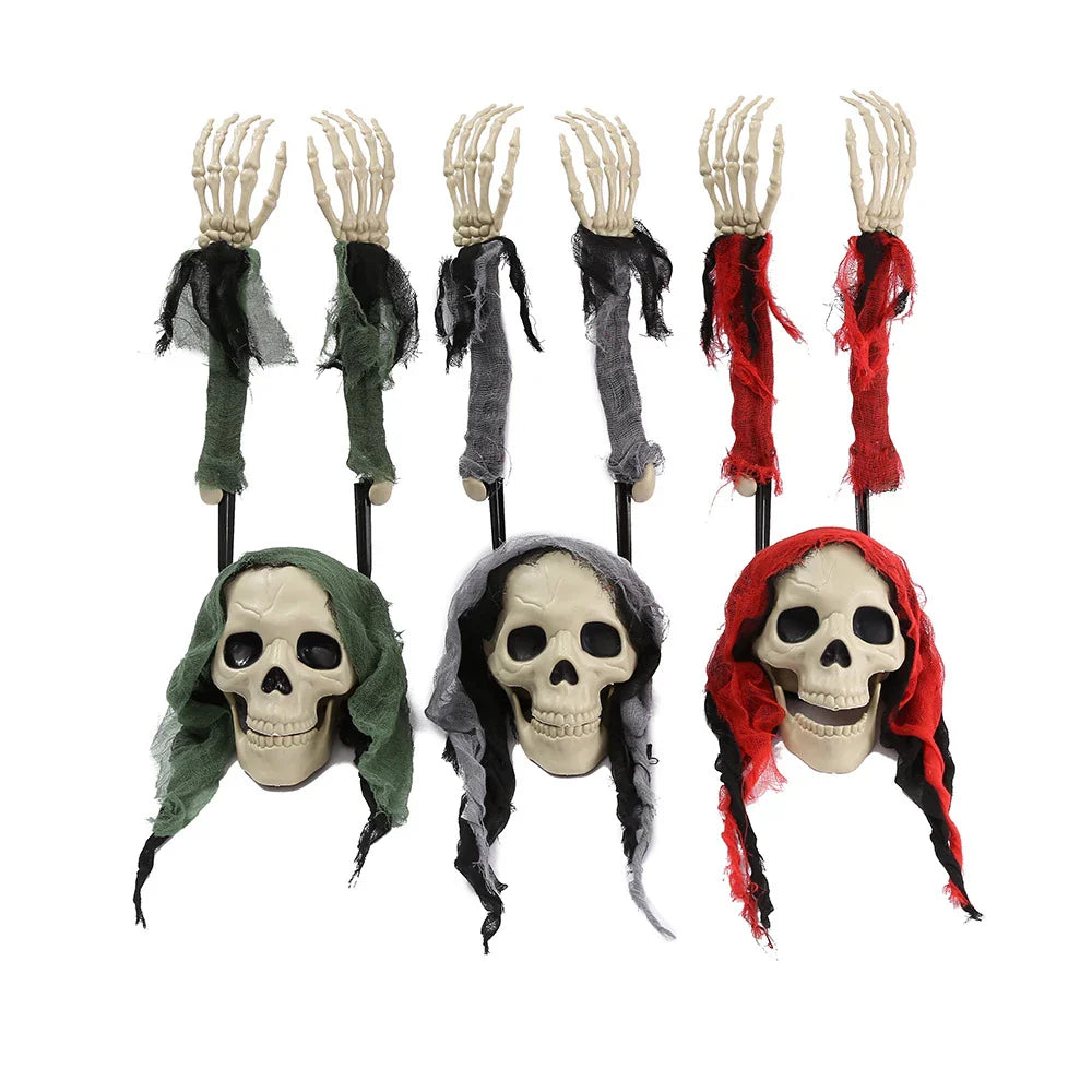 Three handsome skull decorations in green, red, and grey colours for Halloween, Christmas, and Easter celebrations