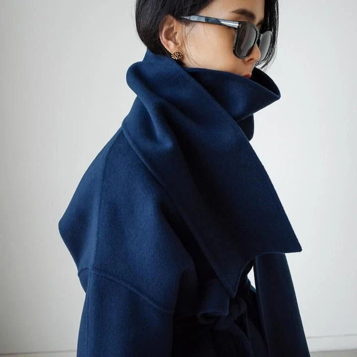 Stylish and warm New Zealand women's woollen coat in blue, featuring a chic scarf collar and relaxed fit design.