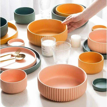 Stylish assorted candy-colored ribbed ceramic tableware set including plates and bowls, made in New Zealand with eco-friendly materials