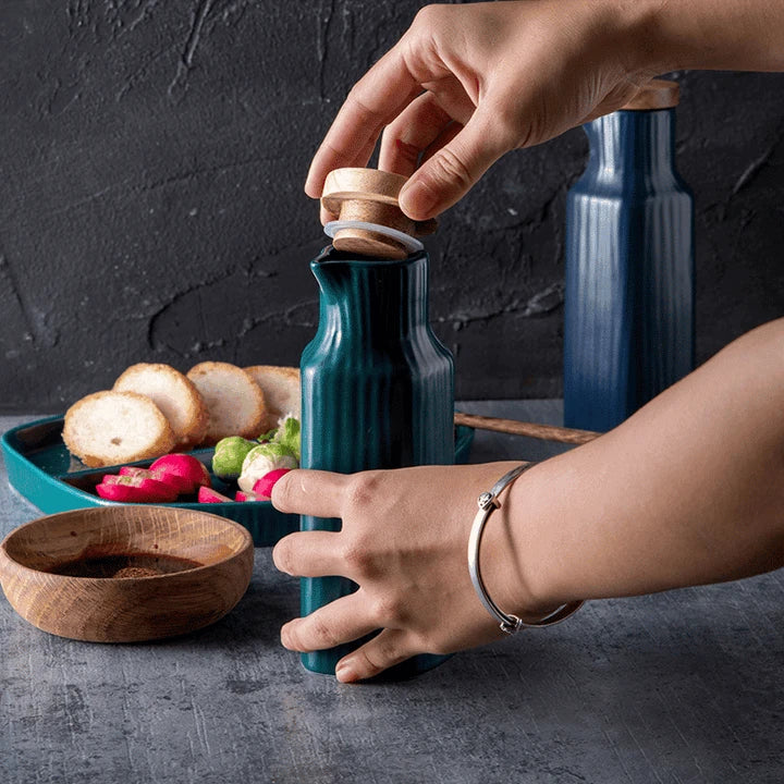 A matte white ceramic oil dispenser with a sleek and minimalist Nordic-inspired design, perfect for any Kiwi kitchen.