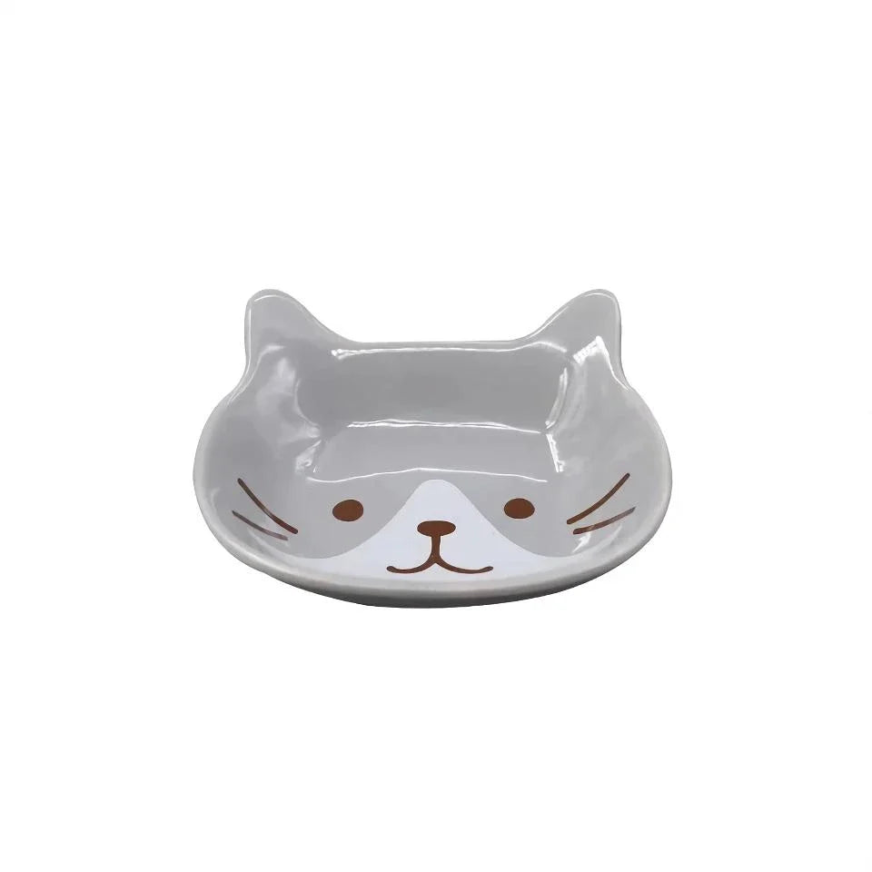 Charming Japanese-style ceramic condiment dish with a playful cat design, perfect for serving sauces, dips, and small snacks.