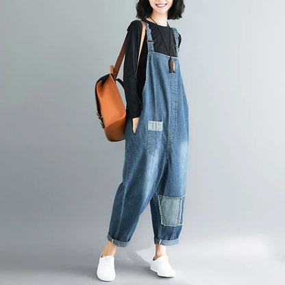 Women's plus-size denim overalls featuring a sustainable, high-waist design with distressed detailing