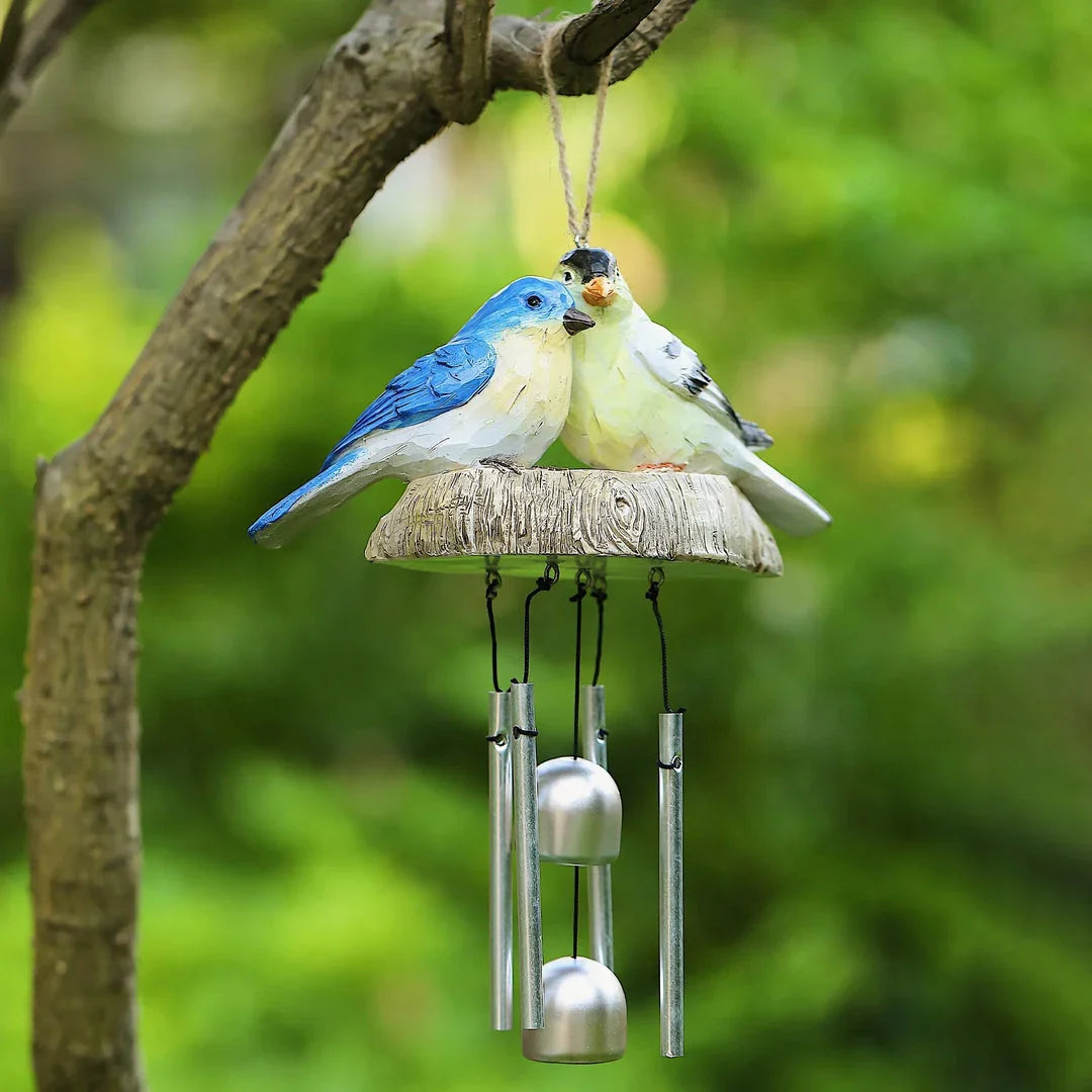 Charming wind chime featuring resin birds in vibrant Kiwi colours, swaying gently in the breeze and emitting a melodious sound.