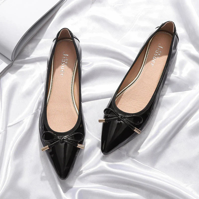 Stylish black pointed toe flats with bow knot and beading detail, perfect for Kiwi fashion