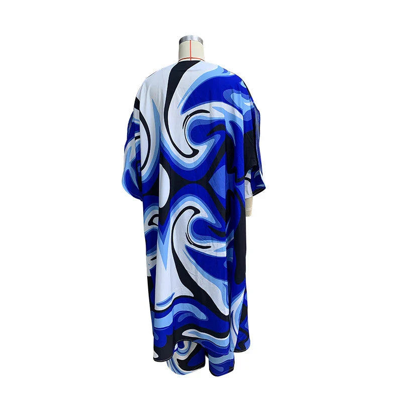 Stylish two-piece set with batwing sleeve top and wide-leg trousers in a vibrant tie-dye pattern