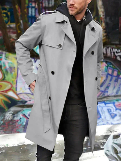 A stylish long sleeve trench coat in a slim, tailored fit with a double-breasted closure and practical side pockets