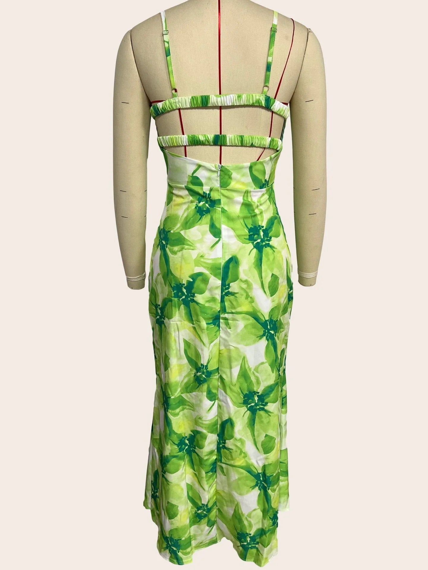 Stylish sleeveless backless midi dress with a vibrant floral print, perfect for any occasion