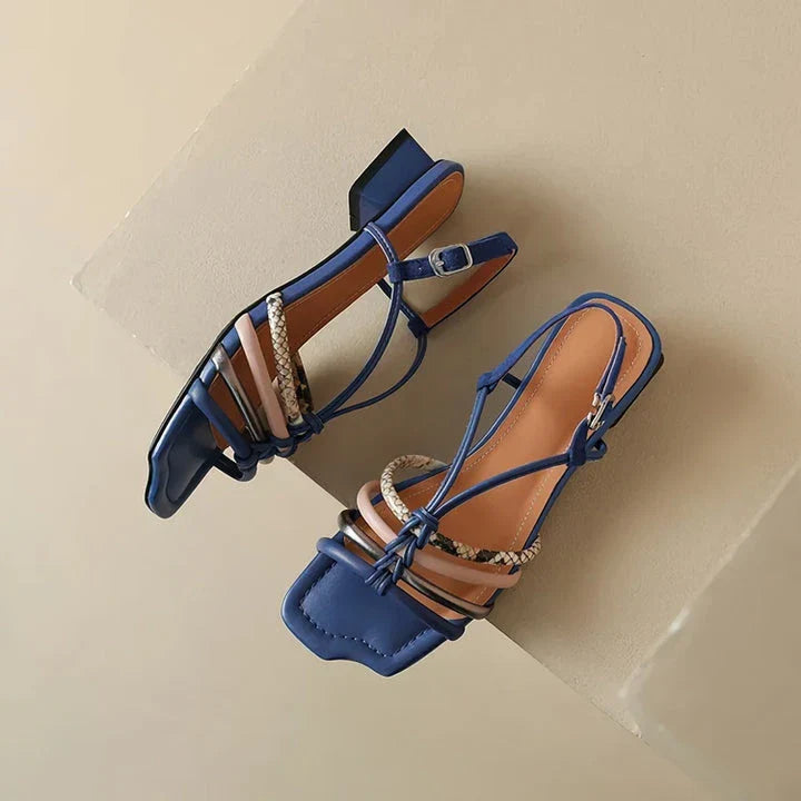Vibrant Roman-inspired sandals with chunky heel, showcasing a stylish and comfortable summer footwear option