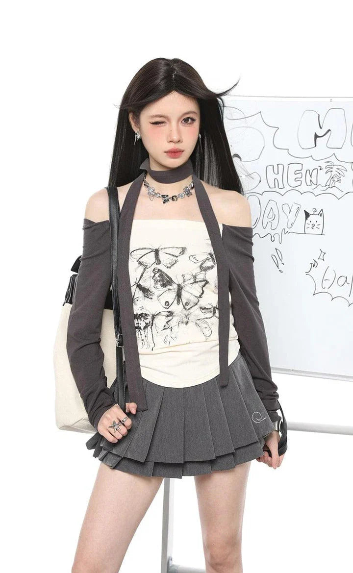 Stylish off-shoulder long sleeve top with elegant butterfly print design, slim-fit silhouette, and short length for a flattering, chic look.