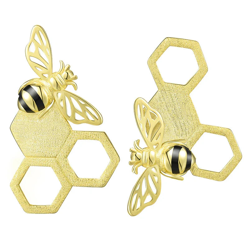 Handcrafted sterling silver beehive ear studs with a unique design inspired by nature's hard workers