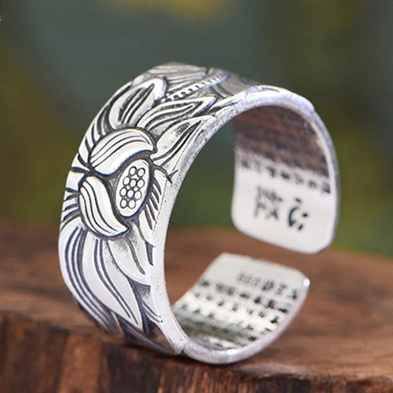 Vintage-style silver-plated Buddhism-inspired ring with lotus flower and Heart Sutra engraving, adjustable size for comfortable fit