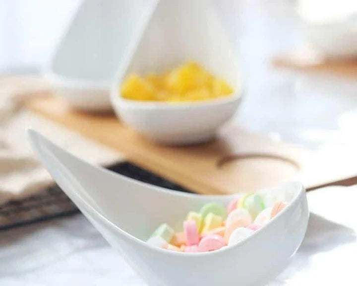 Stylish ceramic snack trays with natural wood pallet, perfect for serving nibbles and entertaining in Kiwi-style homes