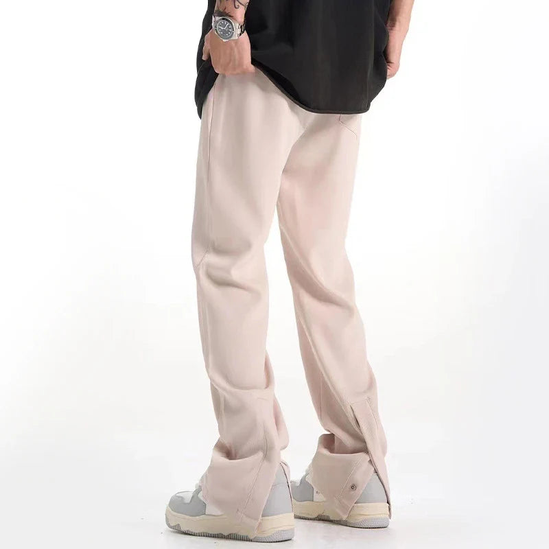 Retro-inspired casual suit pants in black and apricot colors, featuring a mid-waist design and straight leg silhouette for a comfortable, versatile Kiwi look.