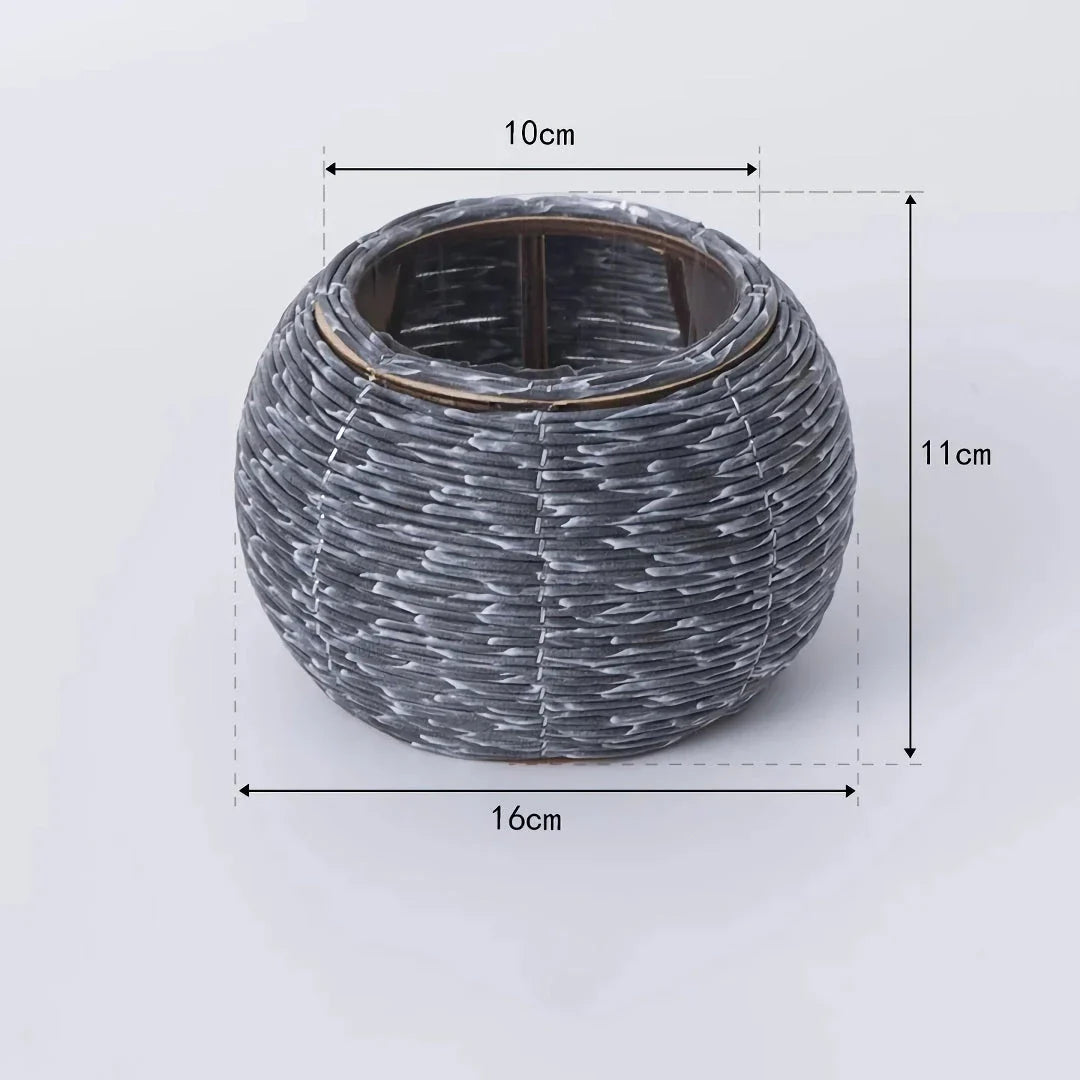Hand-woven rattan planter with lush greenery, perfect for indoor and outdoor display