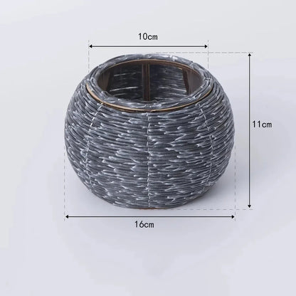 Hand-woven rattan planter with lush greenery, perfect for indoor and outdoor display