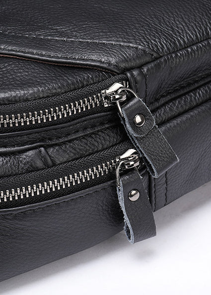 Rugged leather messenger bag with adjustable strap, multiple pockets, and sleek design for the modern Kiwi bloke