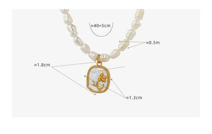 Exquisite gold-toned necklace featuring a delicate chain with embossed floral design and natural freshwater pearls accented by zirconia stones