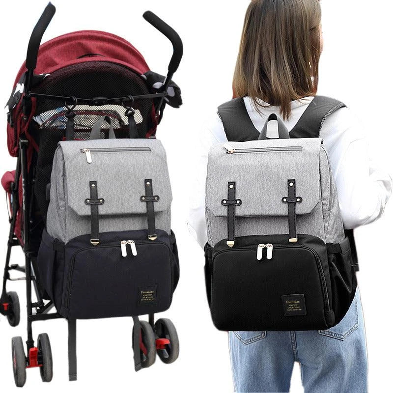 Versatile Mummy Daddy Backpack in Grey, a functional and stylish nappy bag for Kiwi families with a spacious main compartment, insulated pockets, and a USB charging port.