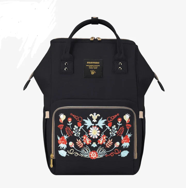 Stylish and practical mummy bag with reinforced handles, durable buckles, and separate bottling area for Kiwi mums