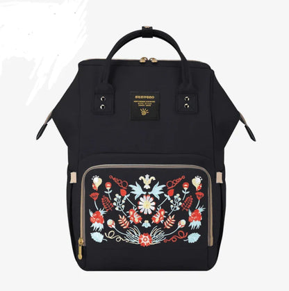 Stylish and practical mummy bag with reinforced handles, durable buckles, and separate bottling area for Kiwi mums