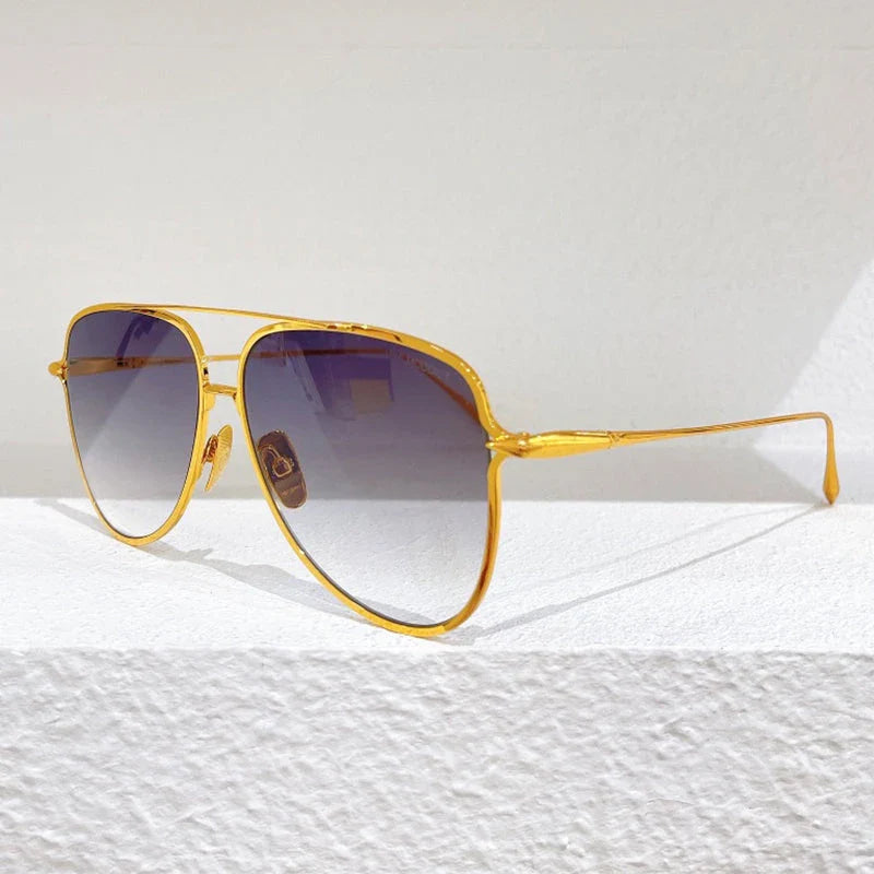 Premium pure titanium pilot sunglasses with a luxurious gold finish, offering superior UV protection and timeless vintage-inspired design.