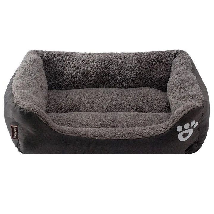 A cozy, waterproof pet bed featuring a soft fleece lining and paw print design, perfect for providing comfort and support for your beloved companion.