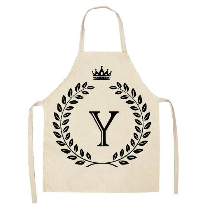 A crown and letter printed kitchen apron made of high-quality cotton and linen, suitable for both men and women in New Zealand kitchens.
