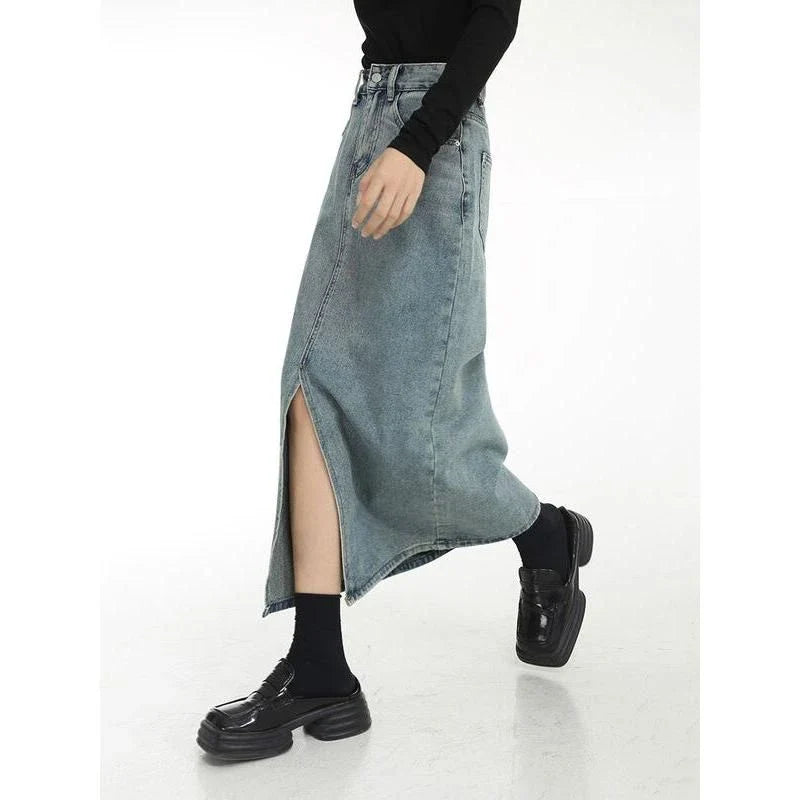 A stylish vintage-inspired denim midi skirt with a front slit, perfect for casual and special occasions.