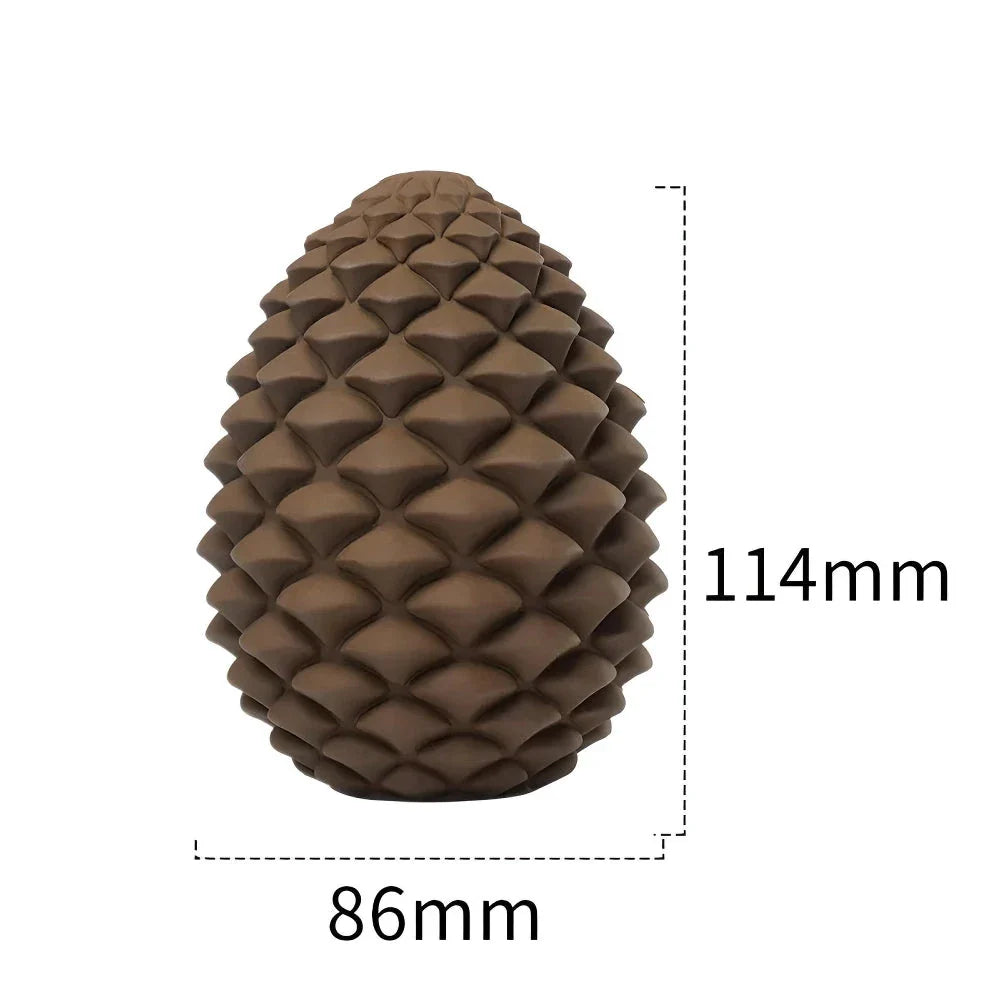 Sustainable pineapple-inspired dog chew toy with textured surface for dental cleaning and treat-dispensing design for mental stimulation