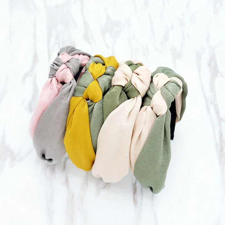 Stylish cross bow patchwork headband in multiple colours, designed for comfortable and fashionable wear