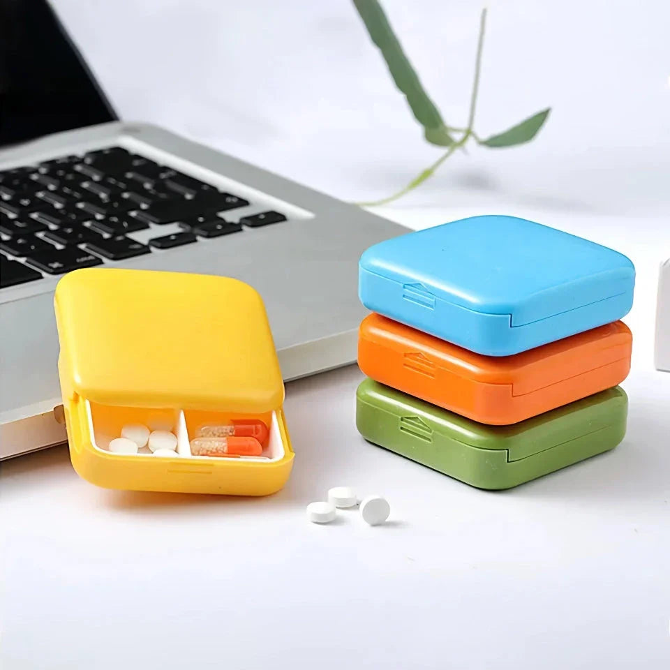 A compact, push-pull pill organiser in a vibrant green colour with cartoon-inspired design