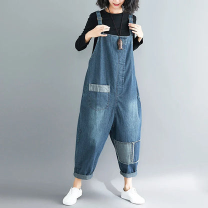 Women's plus-size denim overalls featuring a sustainable, high-waist design with distressed detailing