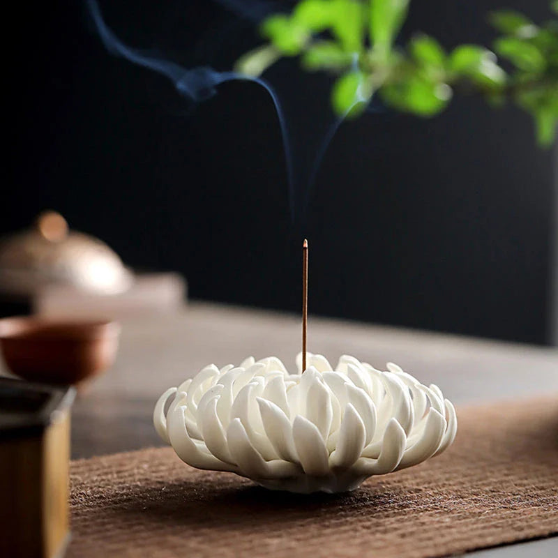 Elegant chrysanthemum ceramic incense burner in white and yellow colours, adding a touch of nature-inspired art and relaxation to Kiwi homes