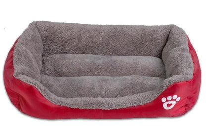 A cozy, waterproof pet bed featuring a soft fleece lining and paw print design, perfect for providing comfort and support for your beloved companion.