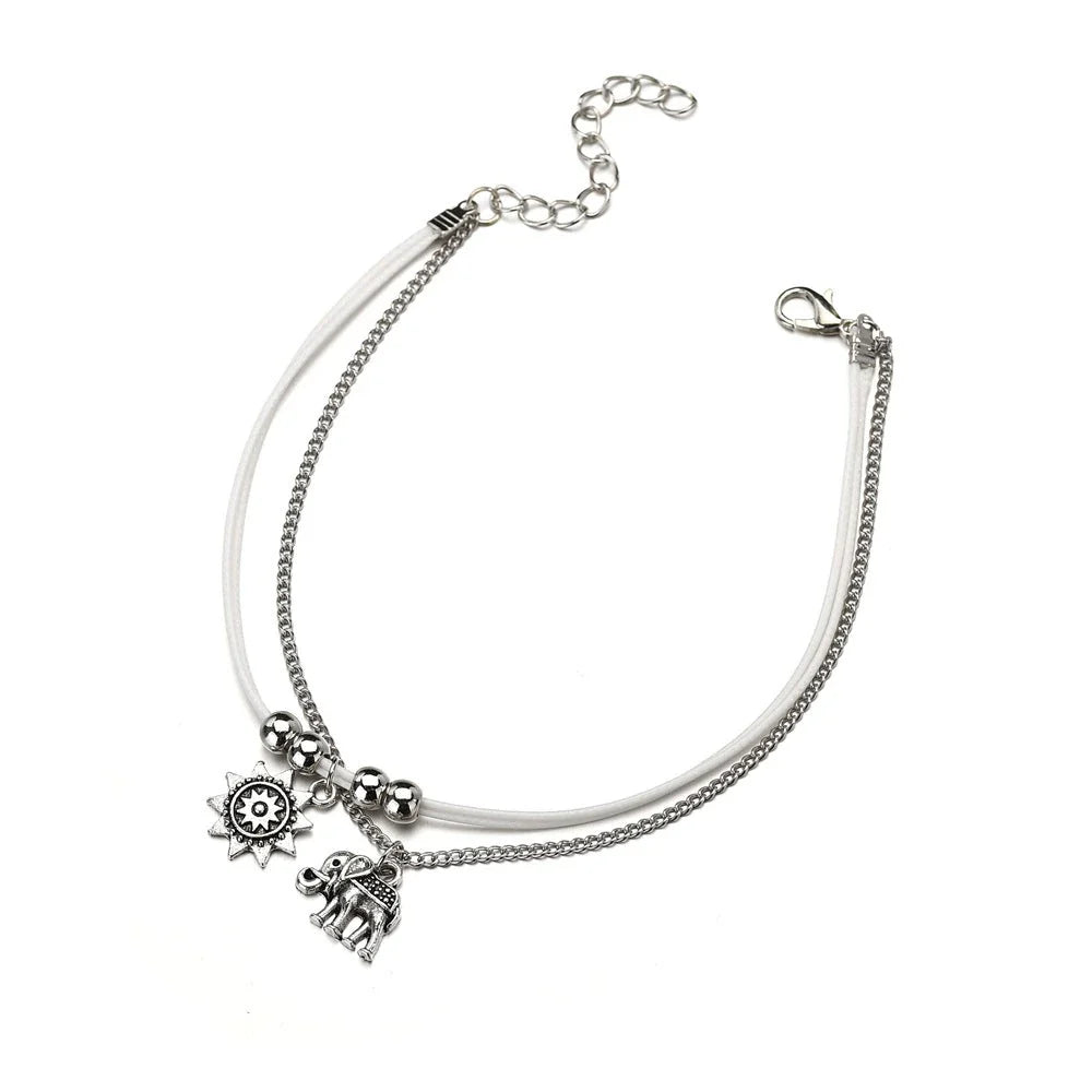 Bohemian-style anklet with star and elephant pendant charms, made from durable zinc alloy in shimmering silver and gold tones