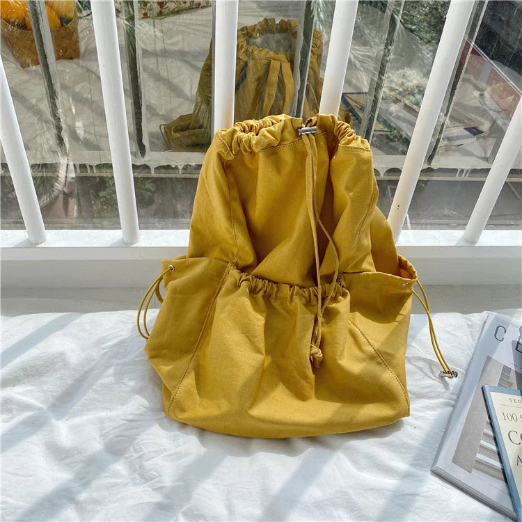 A stylish drawstring bucket bag made of premium polyester fabric, available in a variety of on-trend colours to complement your New Zealand fashion