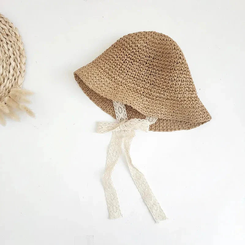Stylish lace baby sun hat with wide brim for sun protection and adjustable strap for a secure fit on Kiwi babies