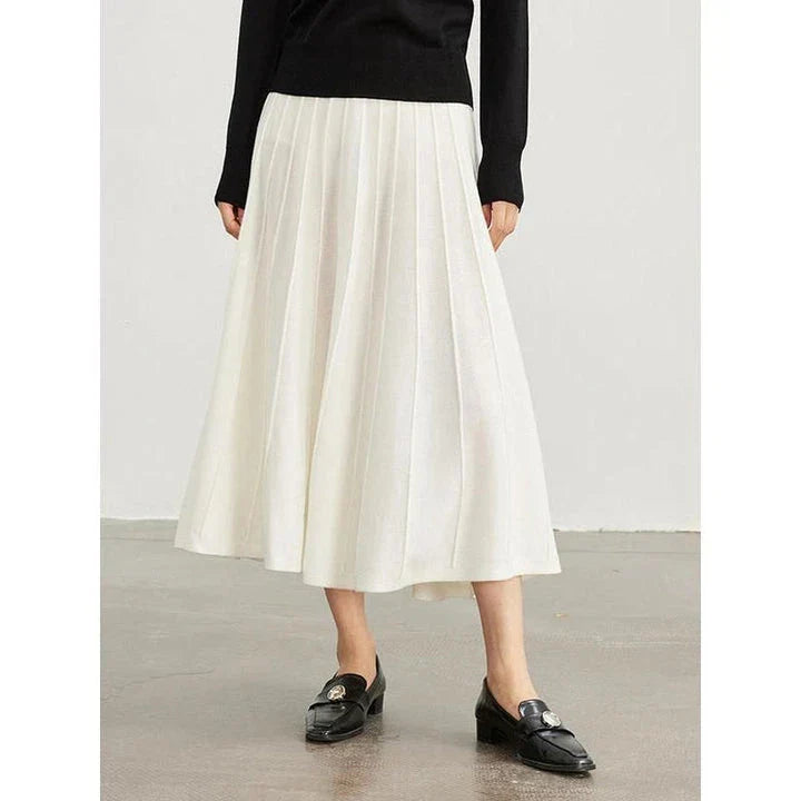 A stylish and versatile mid-calf pleated wool skirt in a chocolate color, perfect for the chilly seasons.