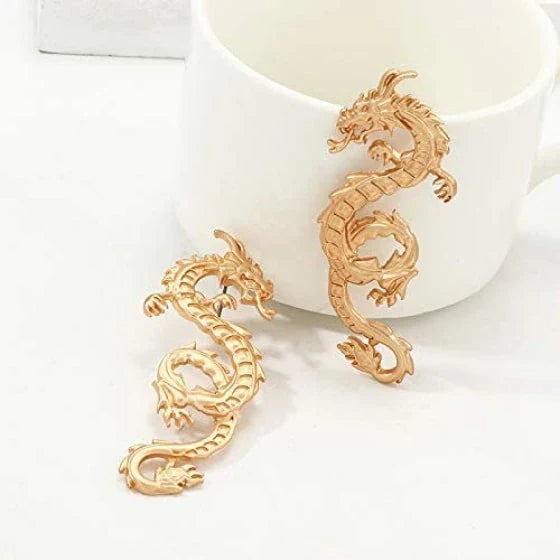 Captivating dragon-shaped stud earrings in gold, a unique New Zealand accessory that adds modern flair to any outfit.