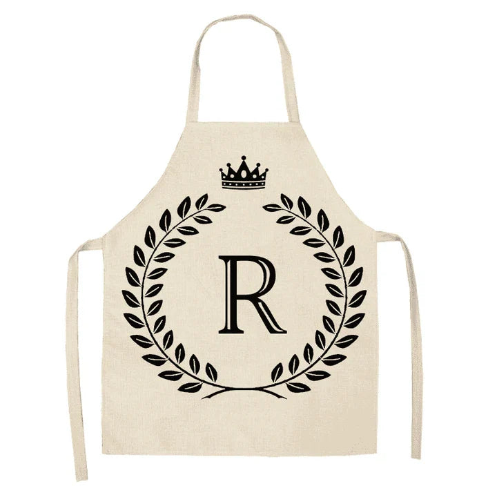 A crown and letter printed kitchen apron made of high-quality cotton and linen, suitable for both men and women in New Zealand kitchens.