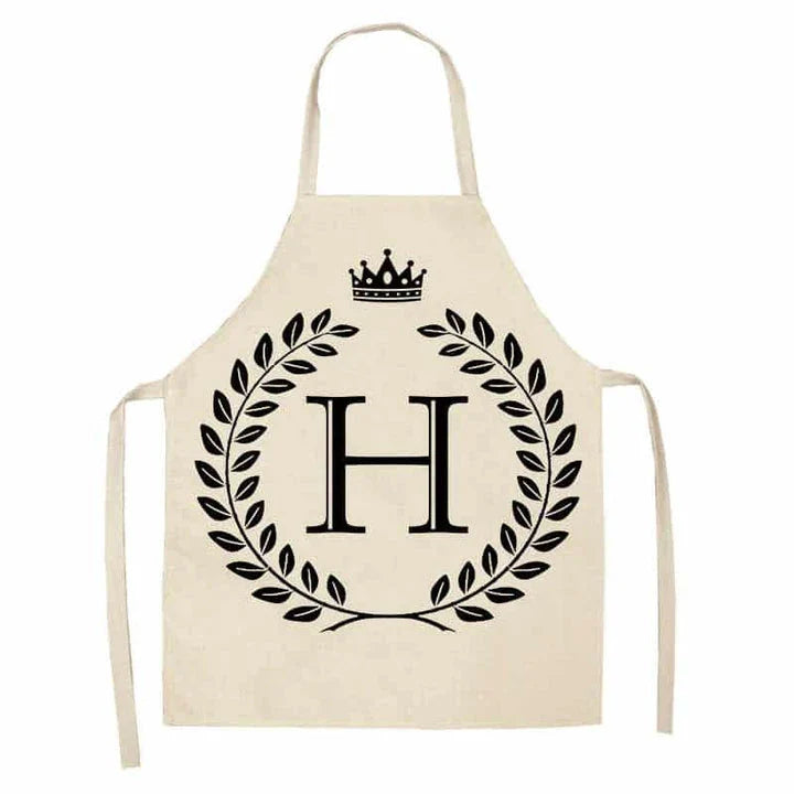 A crown and letter printed kitchen apron made of high-quality cotton and linen, suitable for both men and women in New Zealand kitchens.