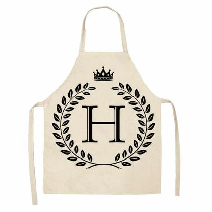 A crown and letter printed kitchen apron made of high-quality cotton and linen, suitable for both men and women in New Zealand kitchens.
