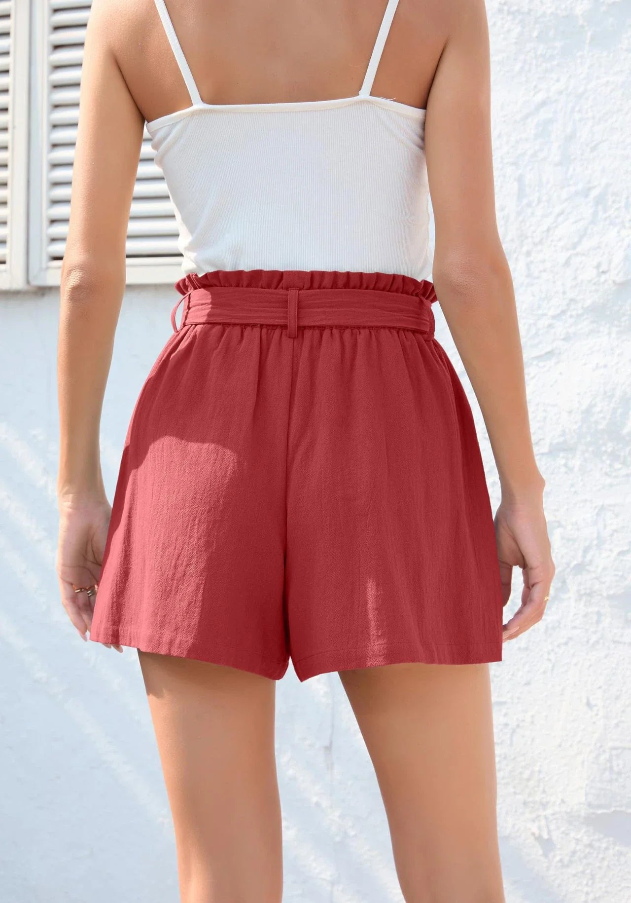 Stylish high-waisted ruffle bow shorts in black, perfect for Kiwi summer beach and casual wear