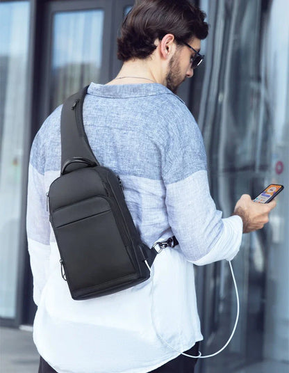 A black, water-resistant crossbody chest bag made from durable Oxford fabric, perfect for everyday use in New Zealand.