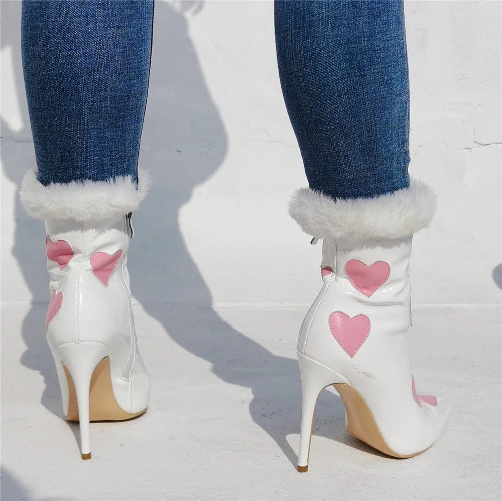 Striking patent leather boots with a peach heart design and pointed toe, perfect for Halloween, parties, or everyday wear.